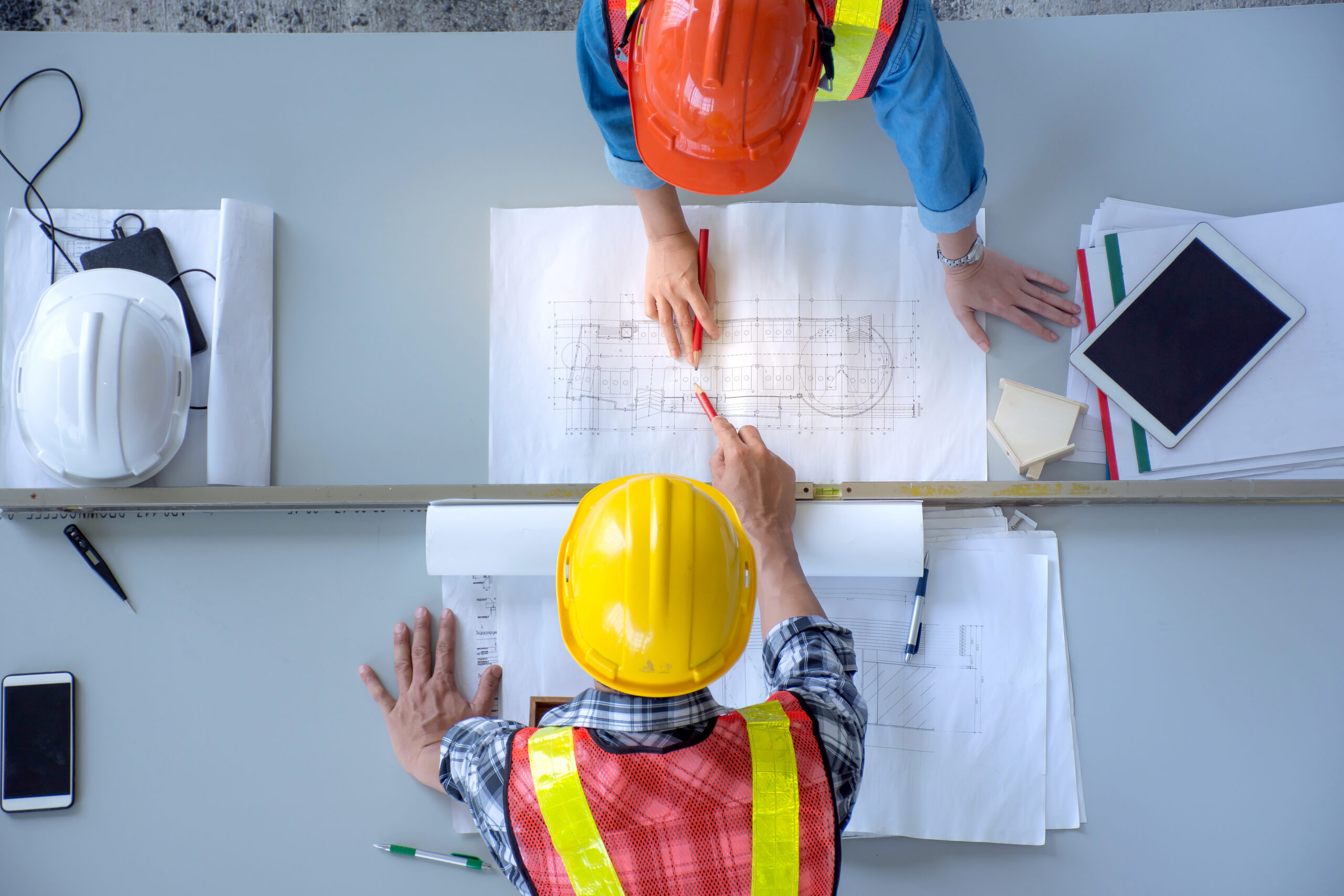 top-view-group-engineering-team-is-meeting-planning-construction-work top-view-group-engineering-team-is-meeting-planning-construction-work